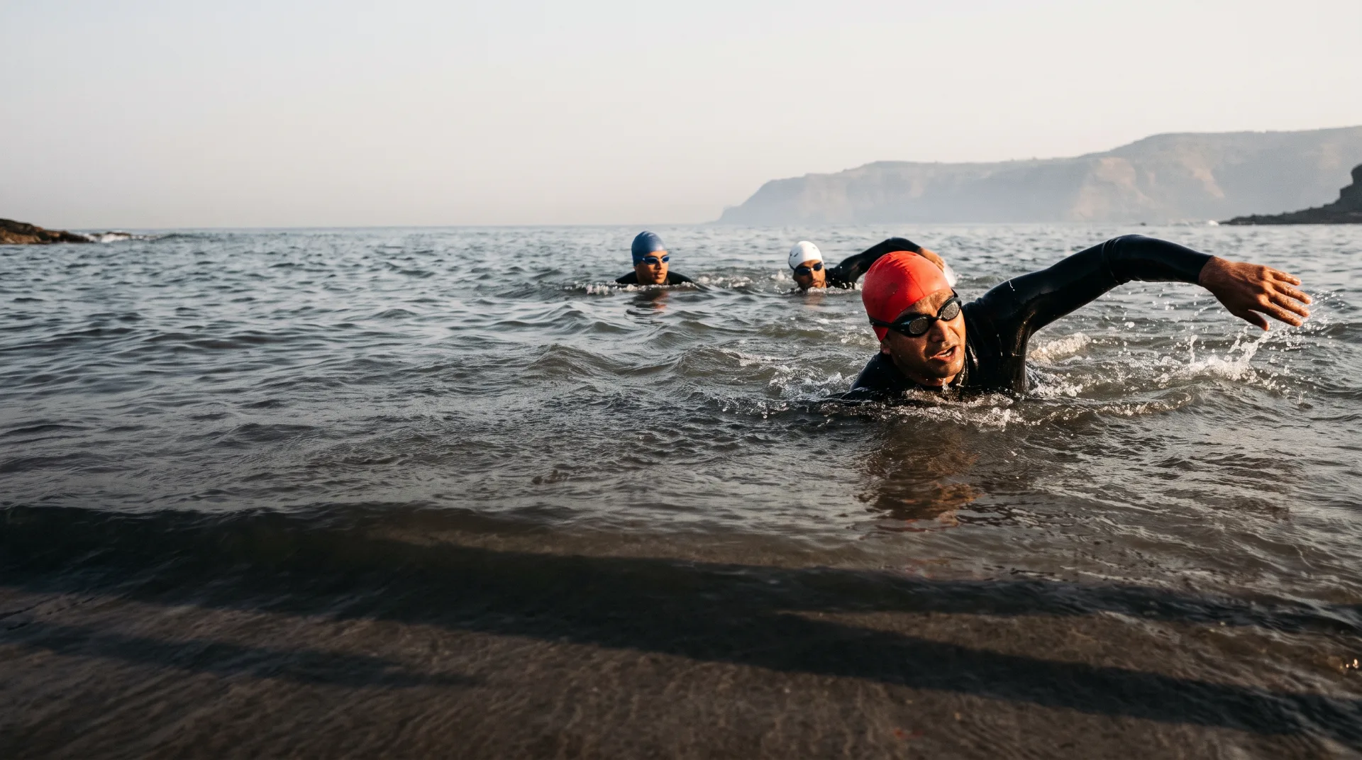 Open water swimmers at first light off the Mumbai coast.